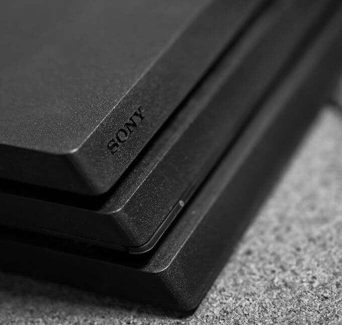 Press and hold the power button on the front of the PS4 until it beeps twice.
Unplug the power cord from the back of the PS4.